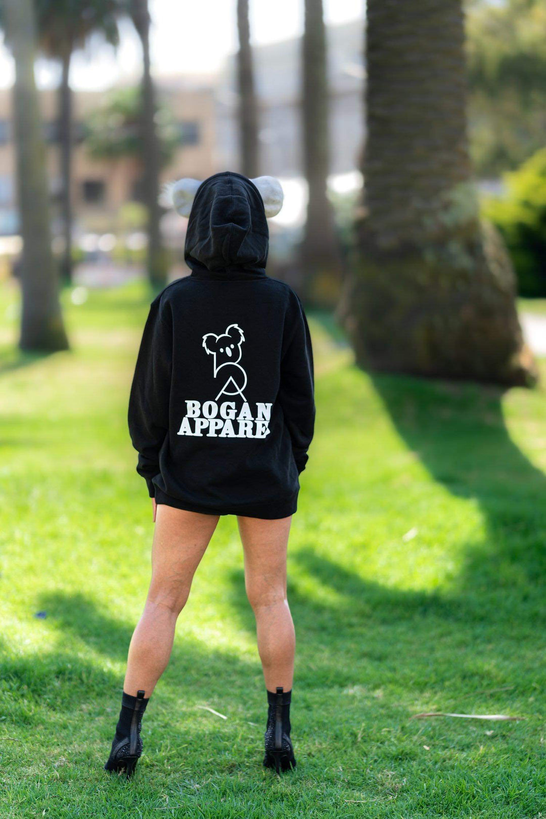 women wearing warm hoodie, black 100% cotton , screen printed in Melbourne 